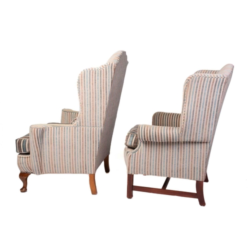 320 - Two George III style wing armchairs, 20th century, each well upholstered in a striped material, one ... 