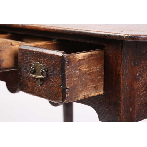 325 - An early 18th-century oak three-drawer side table with turned legs terminating in pad feet. 67 cm wi... 