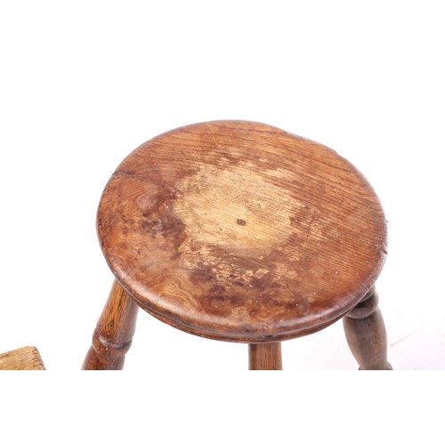 326 - A collection of turned ash and elm stools and also a boarded stool. (5)