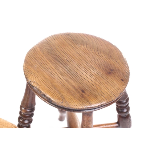 326 - A collection of turned ash and elm stools and also a boarded stool. (5)