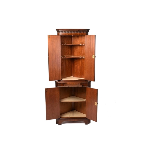 345 - A Reprodux, George III style mahogany two section free standing corner drinks cabinet with small pul... 