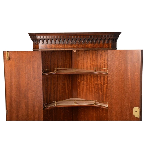 345 - A Reprodux, George III style mahogany two section free standing corner drinks cabinet with small pul... 