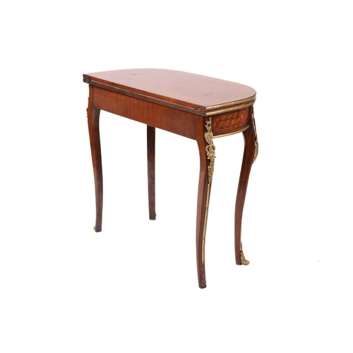 346 - A 19th century style French parquetry inlaid fold-over card table, the D-shape top enclosing leather... 