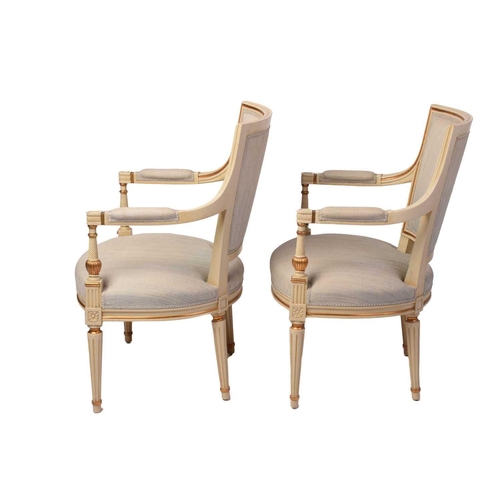 353 - A pair of French fauteuils, 20th century, with upholstered arm rests, back and seat, the sprung seat... 