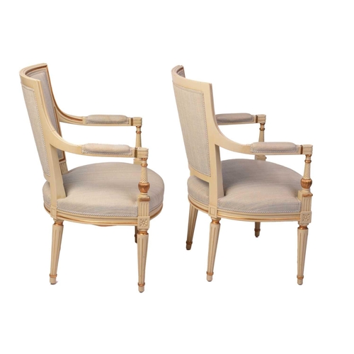 353 - A pair of French fauteuils, 20th century, with upholstered arm rests, back and seat, the sprung seat... 