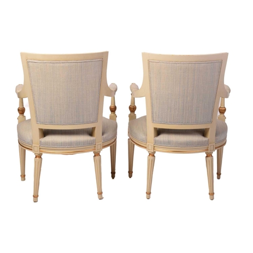 353 - A pair of French fauteuils, 20th century, with upholstered arm rests, back and seat, the sprung seat... 