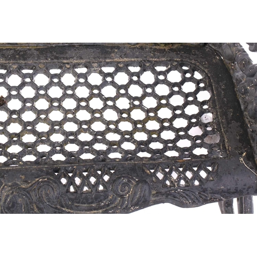 355 - A large heavy cast iron two-seat garden bench, 20th century.