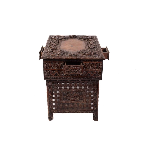 357 - A Chinese carved hardwood centre table, the rectangular top carved with dragons and bats over a simi... 