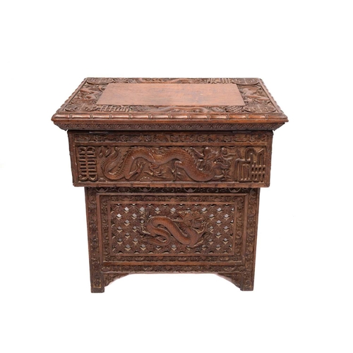 357 - A Chinese carved hardwood centre table, the rectangular top carved with dragons and bats over a simi... 