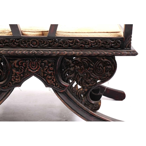 359 - A Burmese carved and red lacquered Howdar seat (elephant seat), 20th century with scroll back and sh... 