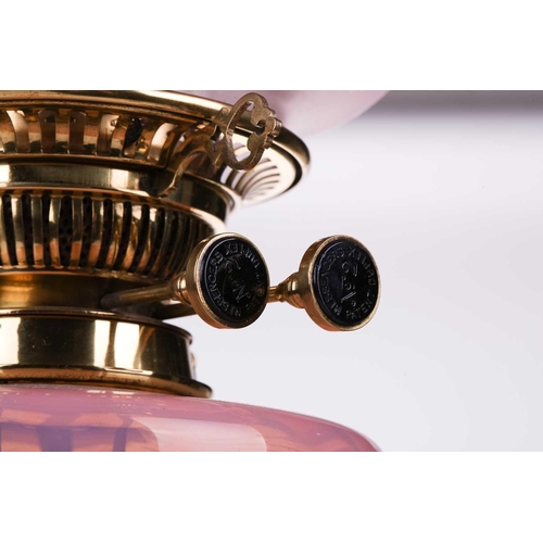 362 - A Victorian brass oil lamp with vaseline and cranberry glass reservoir and diffuser (now fitted for ... 