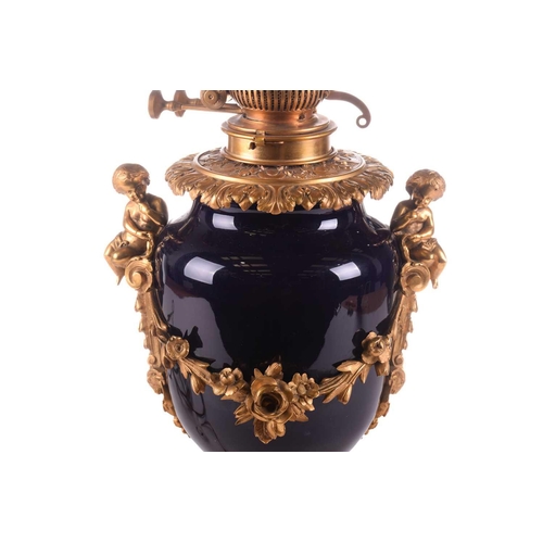 363 - A large French ormolu and cobalt-blue ceramic table lamp, originally converted from an oil lamp, wit... 