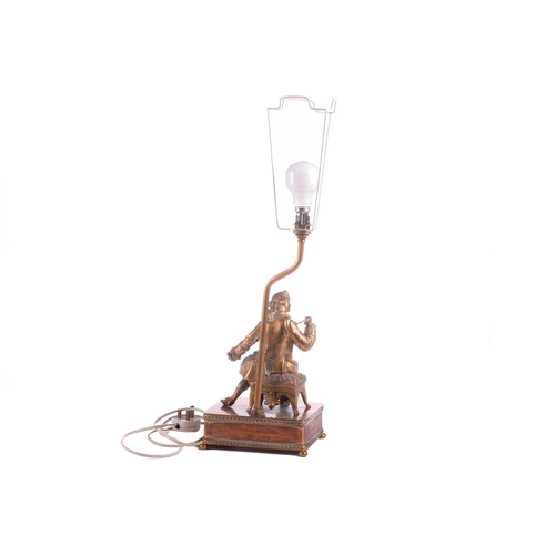 364 - A 20th-century copper and gilt brass figural table lamp, modelled a seated dandy, 68 cm high to incl... 