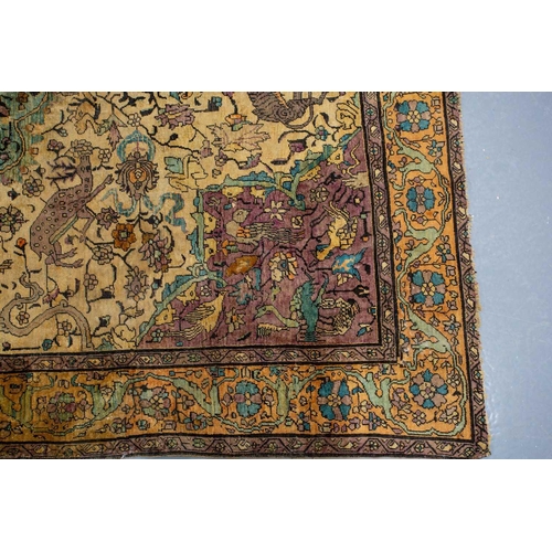 365 - An antique Kashan silk on-silk rug with a central medalion on an ivory ground filled with deer, bird... 