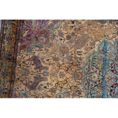 365 - An antique Kashan silk on-silk rug with a central medalion on an ivory ground filled with deer, bird... 