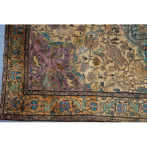 365 - An antique Kashan silk on-silk rug with a central medalion on an ivory ground filled with deer, bird... 