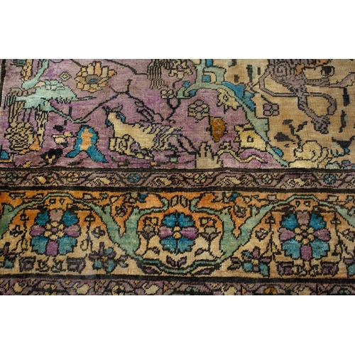 365 - An antique Kashan silk on-silk rug with a central medalion on an ivory ground filled with deer, bird... 