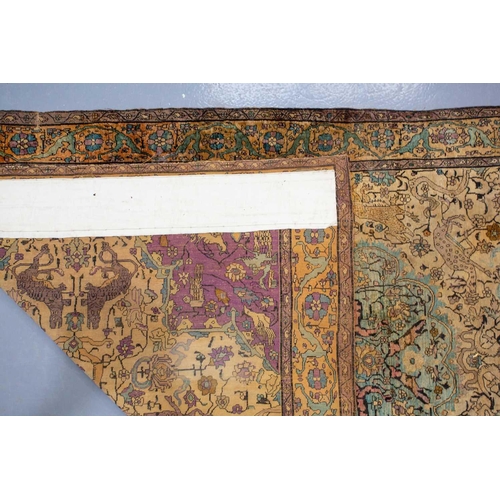 365 - An antique Kashan silk on-silk rug with a central medalion on an ivory ground filled with deer, bird... 