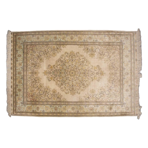 368 - A faded ivory ground Qum silk on silk rug, 20th century, with a central medallion and corners, 184 c... 