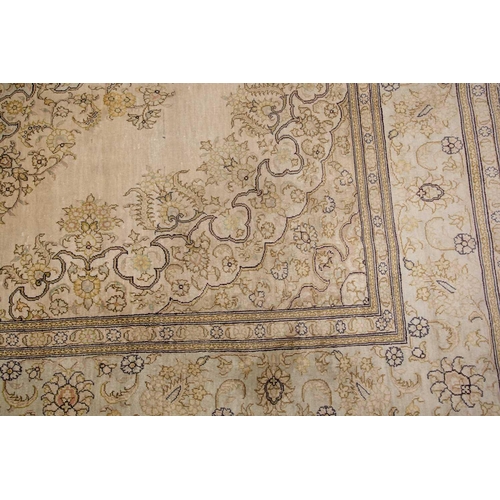 368 - A faded ivory ground Qum silk on silk rug, 20th century, with a central medallion and corners, 184 c... 