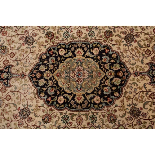 368 - A faded ivory ground Qum silk on silk rug, 20th century, with a central medallion and corners, 184 c... 