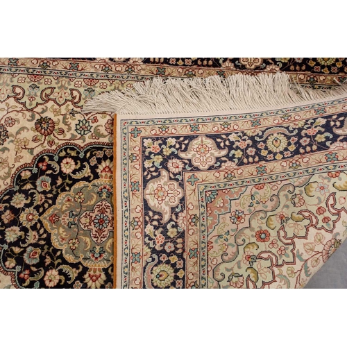 368 - A faded ivory ground Qum silk on silk rug, 20th century, with a central medallion and corners, 184 c... 