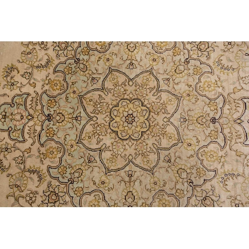 368 - A faded ivory ground Qum silk on silk rug, 20th century, with a central medallion and corners, 184 c... 