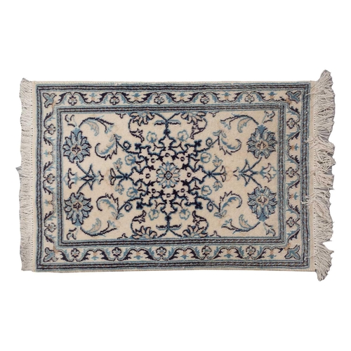 368 - A faded ivory ground Qum silk on silk rug, 20th century, with a central medallion and corners, 184 c... 