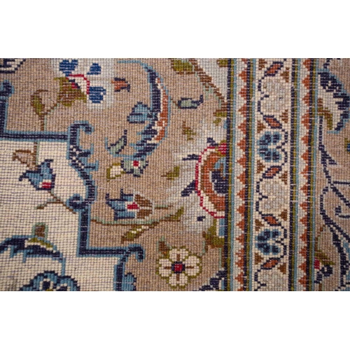 370 - A large Ivory ground Nain carpet with central medalion and hanging lanterns 304cm x 196cm