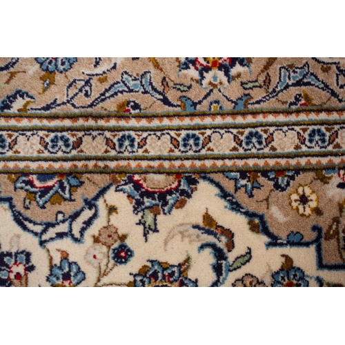 370 - A large Ivory ground Nain carpet with central medalion and hanging lanterns 304cm x 196cm