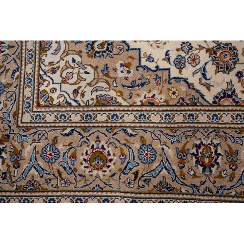 370 - A large Ivory ground Nain carpet with central medalion and hanging lanterns 304cm x 196cm