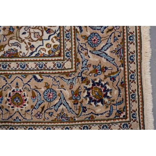 370 - A large Ivory ground Nain carpet with central medalion and hanging lanterns 304cm x 196cm