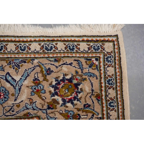 370 - A large Ivory ground Nain carpet with central medalion and hanging lanterns 304cm x 196cm