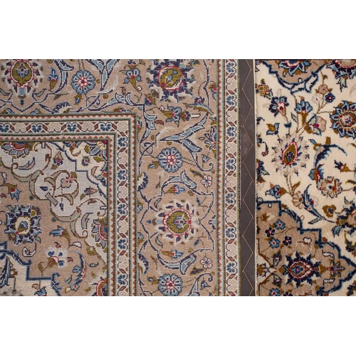 370 - A large Ivory ground Nain carpet with central medalion and hanging lanterns 304cm x 196cm