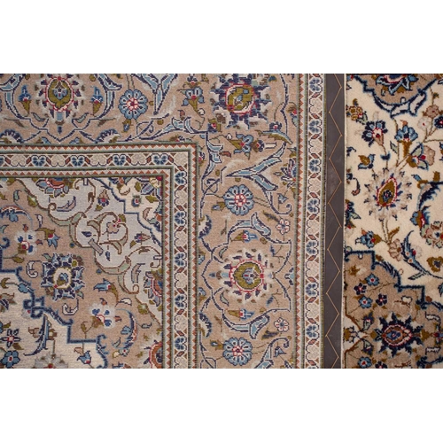 370 - A large Ivory ground Nain carpet with central medalion and hanging lanterns 304cm x 196cm