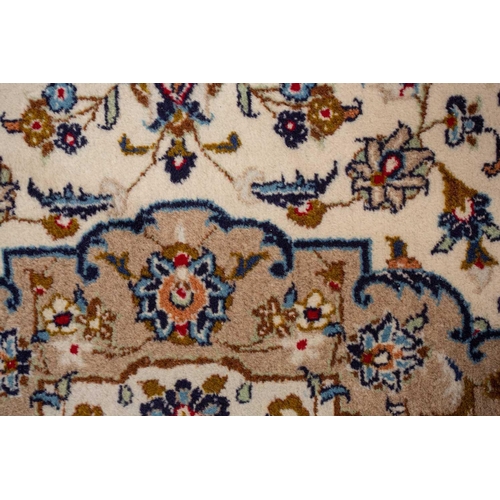 370 - A large Ivory ground Nain carpet with central medalion and hanging lanterns 304cm x 196cm