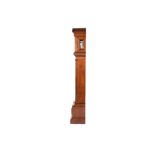 372 - An Austrian single-weight longcase regulator with white enamel Roman dial with a carved oak arched h... 