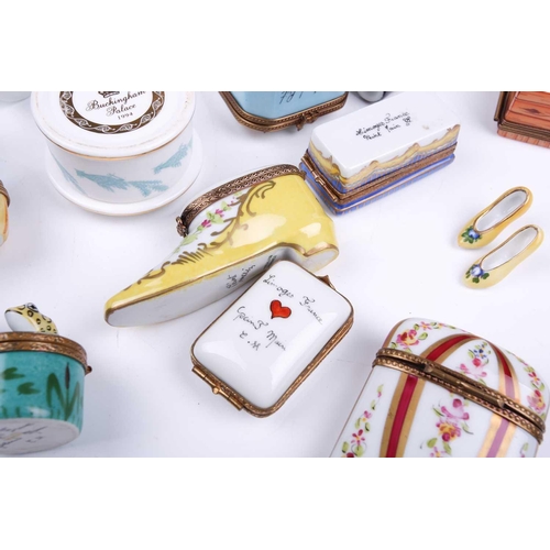 405 - A small collection of Limoges porcelain novelty trinket and pill boxes including boot form box with ... 