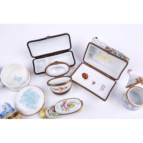 405 - A small collection of Limoges porcelain novelty trinket and pill boxes including boot form box with ... 