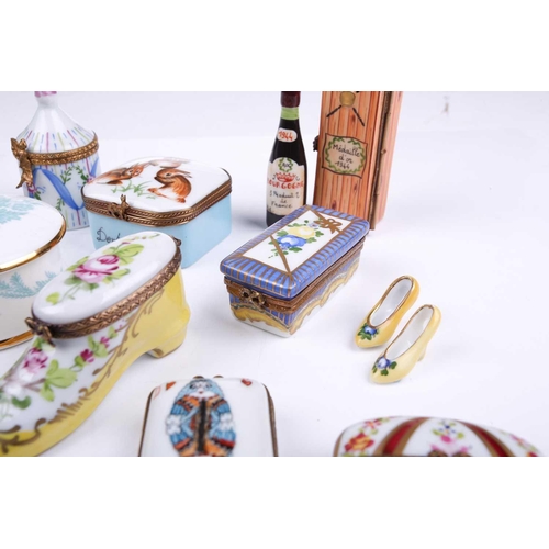 405 - A small collection of Limoges porcelain novelty trinket and pill boxes including boot form box with ... 