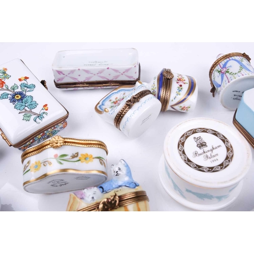 405 - A small collection of Limoges porcelain novelty trinket and pill boxes including boot form box with ... 