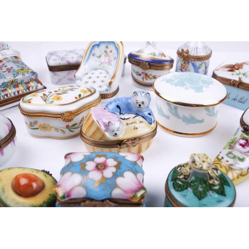 405 - A small collection of Limoges porcelain novelty trinket and pill boxes including boot form box with ... 