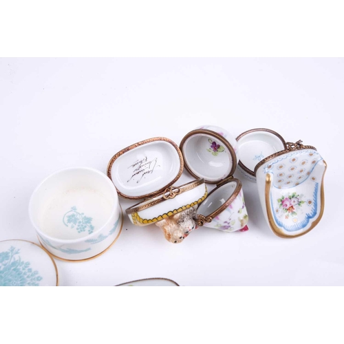 405 - A small collection of Limoges porcelain novelty trinket and pill boxes including boot form box with ... 