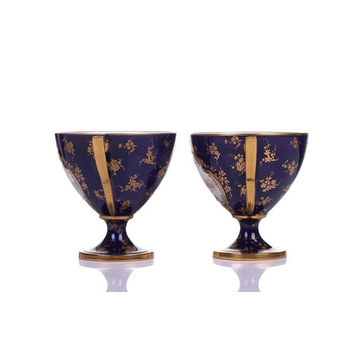 406 - A pair of early 20th century Royal Worcester Bleu de Roi porcelain twin-handled sweetmeat urns, pain... 