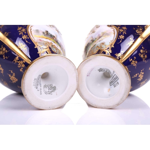 406 - A pair of early 20th century Royal Worcester Bleu de Roi porcelain twin-handled sweetmeat urns, pain... 