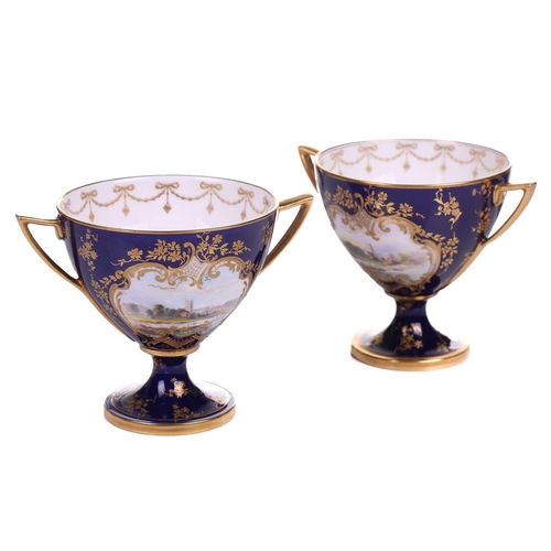 406 - A pair of early 20th century Royal Worcester Bleu de Roi porcelain twin-handled sweetmeat urns, pain... 