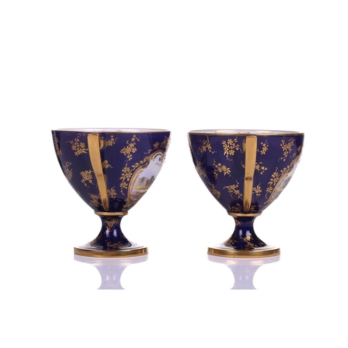 406 - A pair of early 20th century Royal Worcester Bleu de Roi porcelain twin-handled sweetmeat urns, pain... 