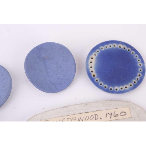 409 - A collection of eight miniature Wedgwood jasperware tablets, mid-18th century and later, the largest... 