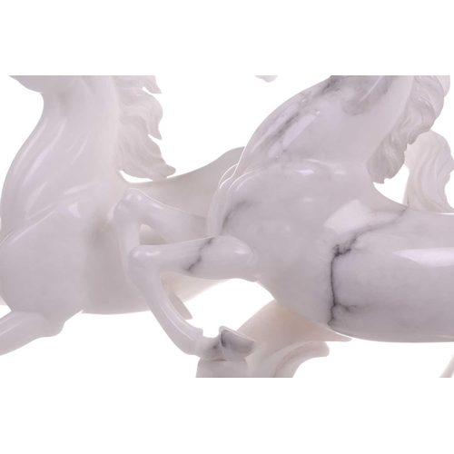 417 - A large contemporary white marble sculpture of two galloping horses, 37 cm x 64 cm.