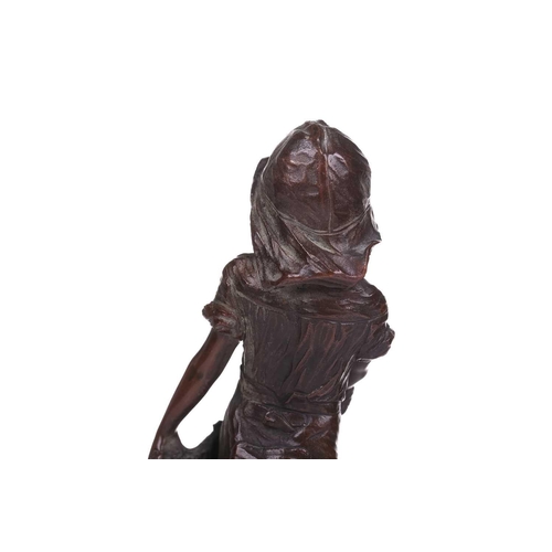 418 - A bronze figure of a young boy with a fishing net, 19th century, French, on a black marble pedestal,... 